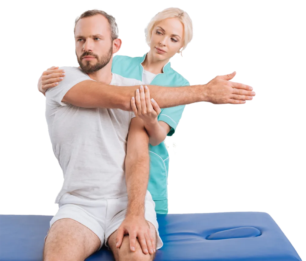 A therapist supporting a patient through an arm and shoulder exercise