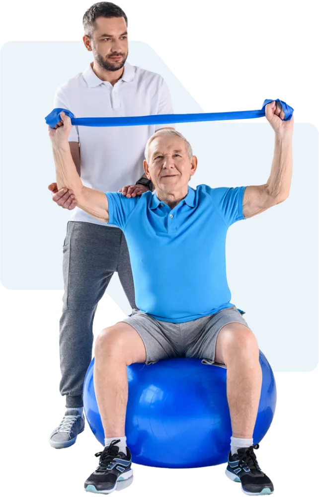 An older patient exercising with a resistance band alongside a therapist