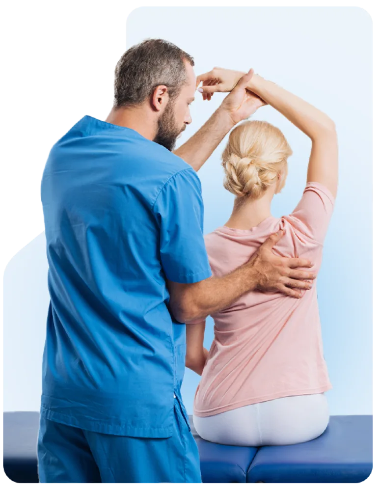 A clinician guiding a patient through a shoulder stretch