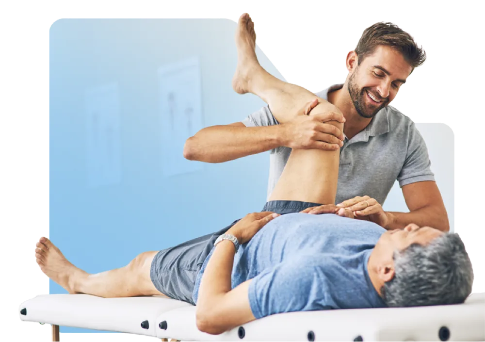 A physiatry clinician mobilising a patient's hip on a treatment table